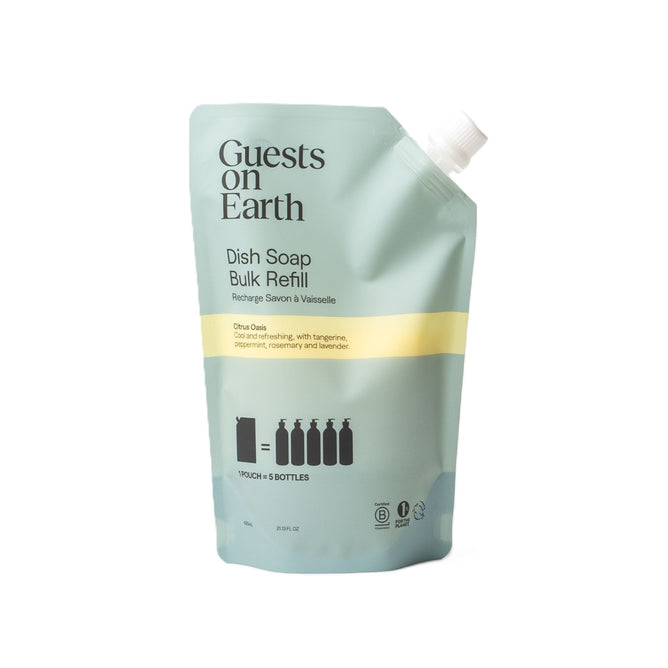 The Guests on Earth Dish Soap Bulk Refill comes in a light green pouch with a spout, featuring Citrus Oasis scent. It includes an illustration indicating it refills five bottles, contains 25 fl oz, and is perfectly paired with reusable aluminum vessels for an eco-friendly kitchen.