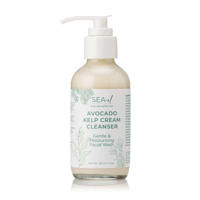 A clear pump bottle labeled Sea-el Avocado Kelp Cream Cleanser, showcasing ocean-inspired ingredients and botanical designs, promises a calming and nourishing cleanse for your skin.