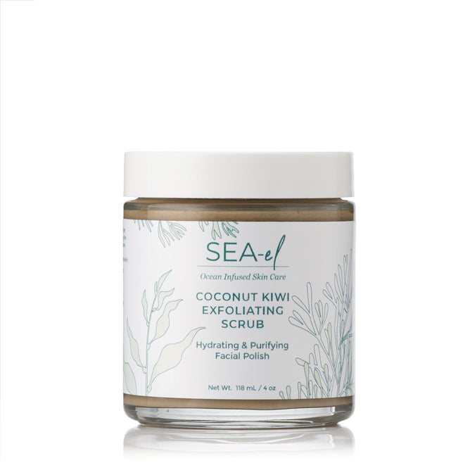 A 118 mL (4 oz) jar of Sea-el Coconut Kiwi Exfoliating Scrub with a white lid features green botanical illustrations and text describing this hydrating facial exfoliant with coconut and kiwi.