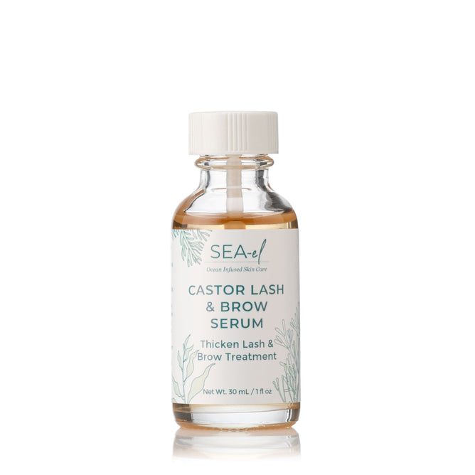 A clear glass bottle with a white cap labeled “Sea-el Castor Lash & Brow Serum,” shown against a white background.