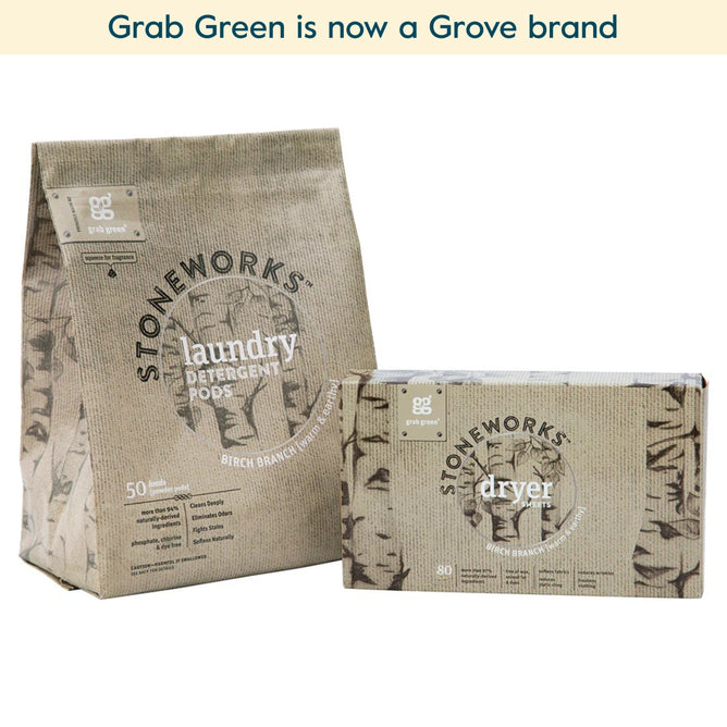 Two grab green Stoneworks products: a bag of laundry detergent pods and a box of Birch Branch Dryer Sheets (Coming Soon!) in brown kraft packaging. Dryer sheets soften fabrics and reduce static cling. Text: “Grab Green is now a Grove brand.”.