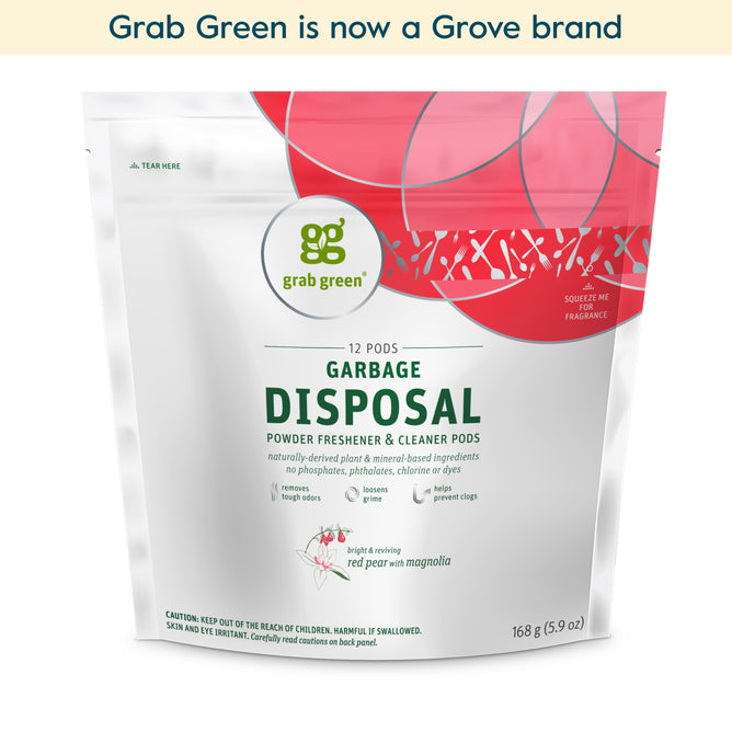 A white and red pouch labeled grab green Garbage Disposal Freshener & Cleaner Pods – Red Pear with Magnolia (Coming Soon!), featuring plant-based ingredients, 12 vegan pods, and the grab green logo at the top.
