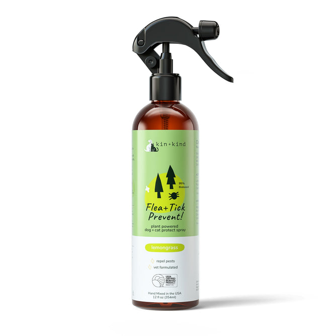 The kin+kind Pet Flea & Tick Protect Spray for Dogs is a 12 fl oz brown bottle with a black nozzle, featuring a green and yellow design of trees and leaves. Its USDA organic, plant-powered, lemongrass-scented, vet-formulated, cruelty-free protection for pets.