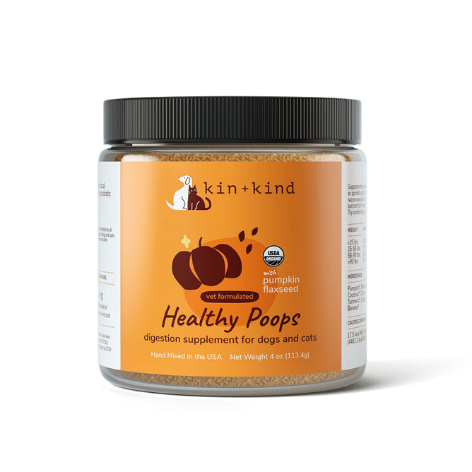 A 4 oz container of kin+kind Digestive Support Powder Supplement for dogs and cats, adorned with pumpkin and flaxseed imagery. This vet-formulated blend is rich in prebiotic fiber and USDA organic certified.