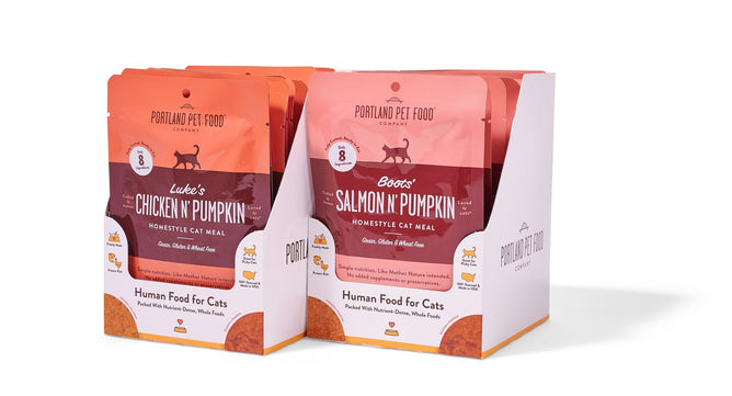 Two packs of Portland Pet Food Companys Cat Meal Variety Pack, featuring human-grade, grain-free Lukas Chicken N Pumpkin and Boos Salmon N Pumpkin wet puree, emphasize natural ingredients for a wholesome cat meal. Each pouch is 2.6 oz.