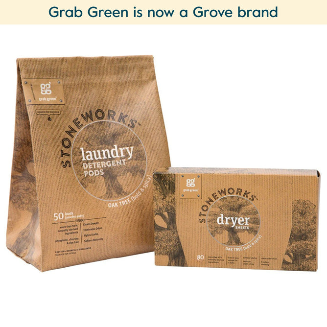 Two brown, eco-friendly grab green packages—Stoneworks Laundry Pods and Dryer Sheet Kit - Oak Tree (Coming Soon!)—with oak tree illustrations sit side by side on a white surface, a green banner above them.