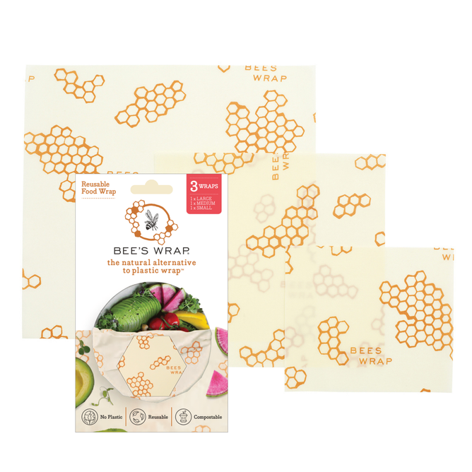 Bees Wrap Assorted Wraps, in three sizes with a honeycomb pattern and “BEE’S WRAP” text, offer an eco-friendly, compostable alternative to plastic wrap highlighted on the packaging.