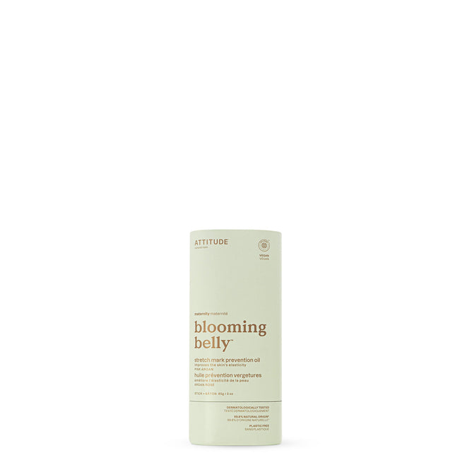 The ATTITUDE blooming belly Body Oil Stretch Mark Prevention Stick features minimalist beige packaging with brown text on a white background and is formulated to help prevent pregnancy stretch marks.