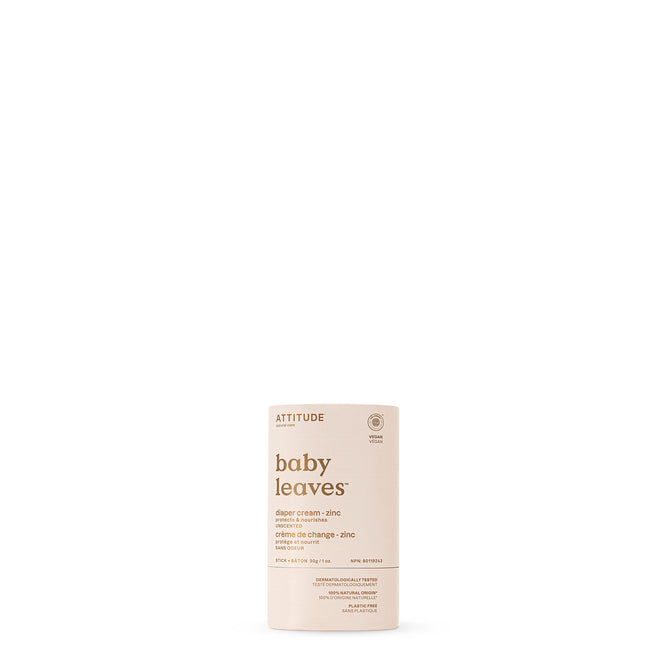 A cylindrical container of ATTITUDE baby leaves Diaper Cream stands upright on a white background. The light beige packaging displays minimalist text about the product’s natural ingredients.