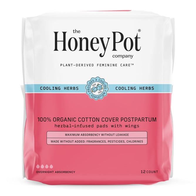 A package of The Honeypot Company 100% Organic Cotton Cover Cooling Herbal Infusion Postpartum Pads With Wings contains 12 overnight absorbency pads in pink and white packaging highlighting cooling herbs.
