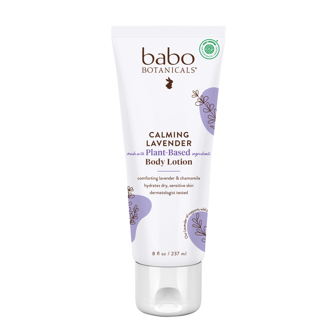 An 8 fl oz tube of Babo Botanicals Calming Lotion, in a soothing white and purple design, is hypoallergenic and features lavender and chamomile for dry, sensitive skin.