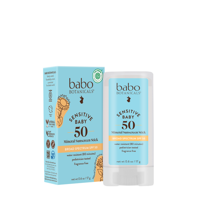 The Babo Botanicals Sensitive Baby Mineral Sunscreen Stick SPF50 is shown with its light blue and white packaging. Both the stick and box highlight gentle, fragrance-free mineral sunscreen and broad spectrum SPF50 protection.
