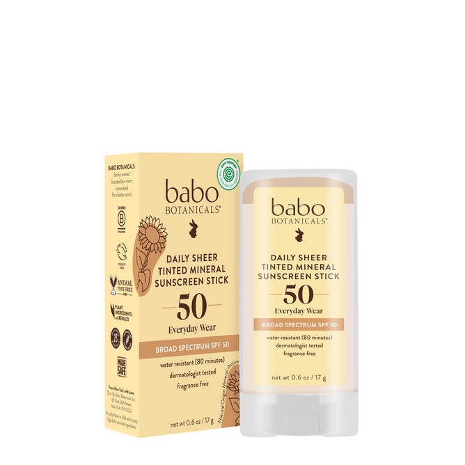 Babo Botanicals Daily Sheer Tinted Mineral Sunscreen Stick SPF50 offers fragrance-free, mineral sun protection in a tinted stick, perfect for everyday use. Shown with its beige box featuring sunflowers and product details.