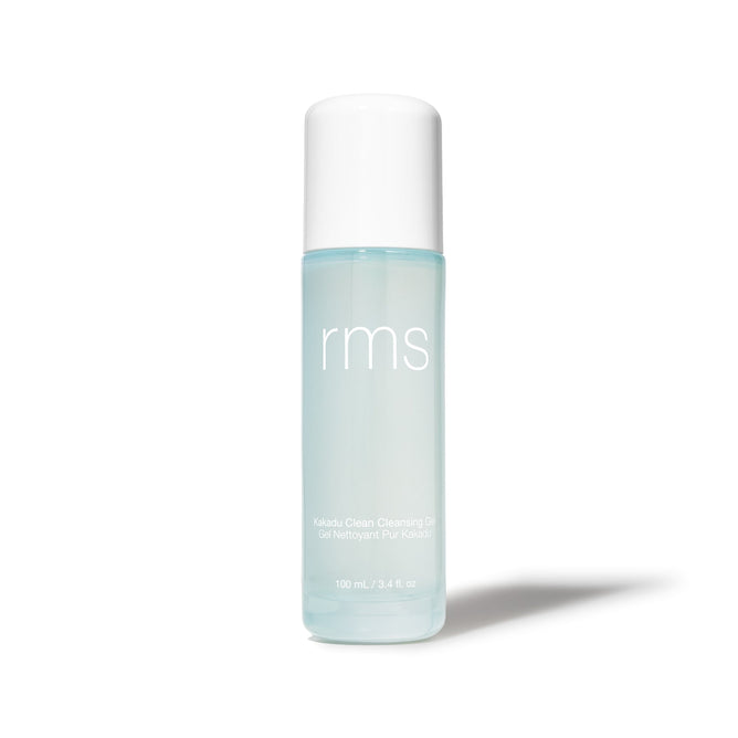 A clear bottle of RMS Beauty Kakadu Clean Cleansing Gel, a gentle foaming cleanser. The white-capped bottle contains light blue gel and features the product name and 100 mL / 3.4 fl oz size on a white label.