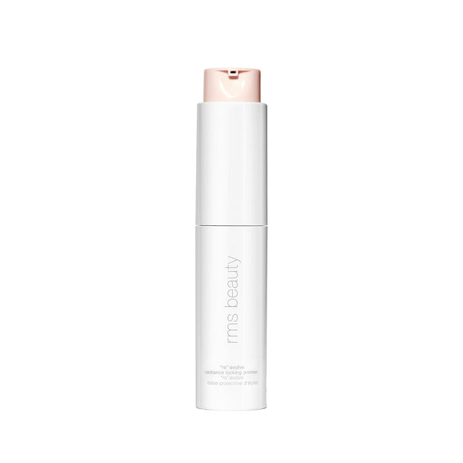 A white bottle of RMS Beauty ReEvolve Radiance Locking Primer, featuring a refillable design and beige pump dispenser, stands upright against a plain white background.