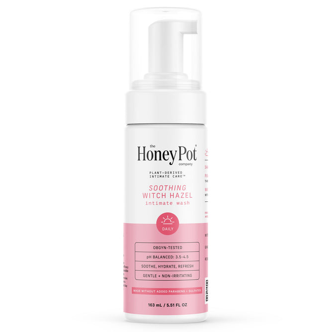 A white bottle of The Honeypot Company’s Soothing Witch Hazel Intimate Wash with a pink label, foam pump, and info highlighting gentle, plant-derived care for healthy vaginal pH.