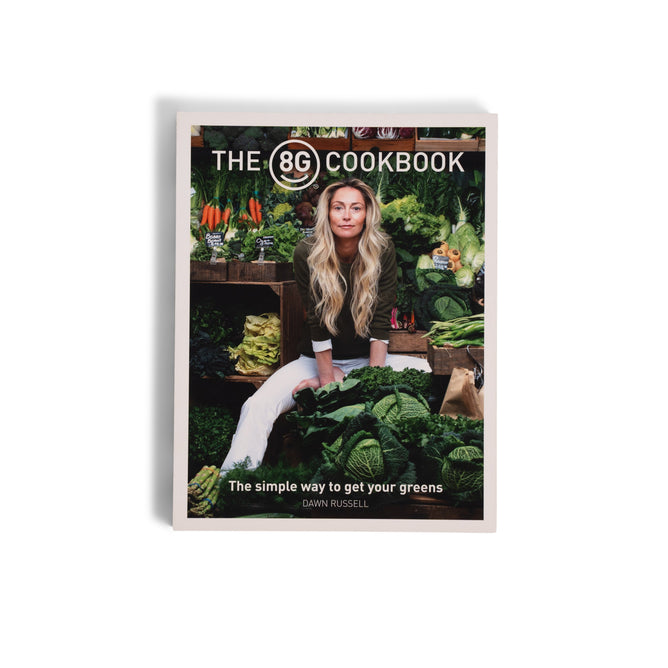 The 8Greens Cookbook by Dawn Russell from 8Greens features a woman with long blond hair surrounded by green vegetables on the cover, highlighting nutrition. The tagline says: The simple way to get your greens.