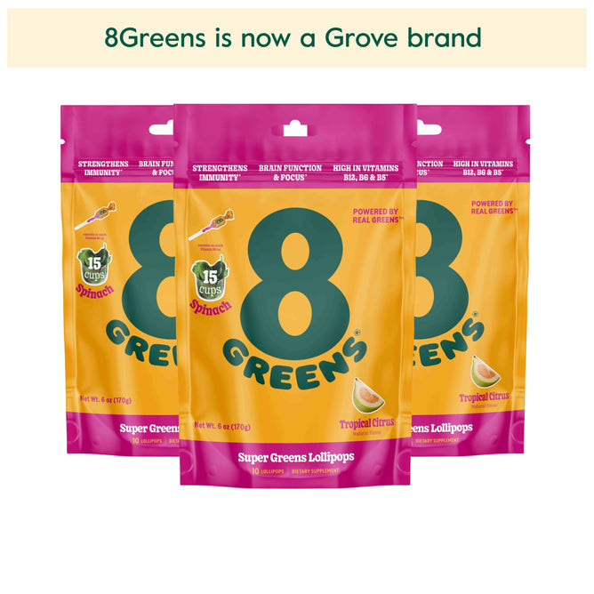 Image of three vibrant orange and pink 8Greens Super Greens Lollipop packages with 8Greens is now a Grove brand above. These Tropical Citrus flavor lollipops claim benefits such as enhanced brain function, immunity support, and high vitamin content.