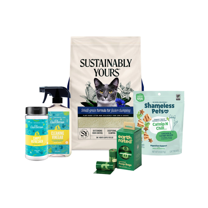 The Grove Collaborative New Cat Essentials - Large Bundle includes cat litter, treats, cleaning vinegar spray, carpet refresher, and pet waste bags—all displayed against a white background.