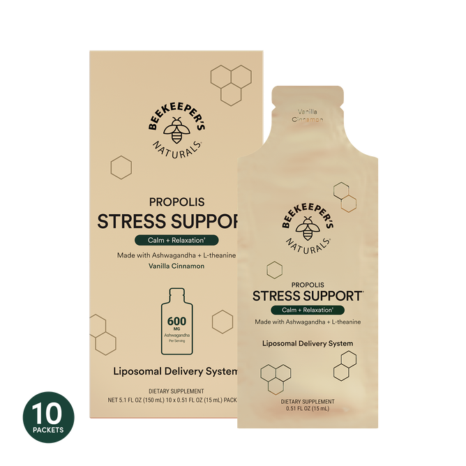 A box of Beekeeper’s Naturals Stress Support Liposomal, Vanilla Cinnamon flavor, with KSM-66 Ashwagandha and L-theanine. Beige packaging with black text and honeycomb design; contains 10 packets per box.
