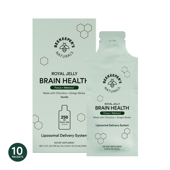Box and packet of Beekeeper’s Naturals Brain Health Liposomal supplement, vanilla flavor, for focus, memory, and cognitive function. Light green packaging with honeycomb design shows 10 packets indicated in the corner.