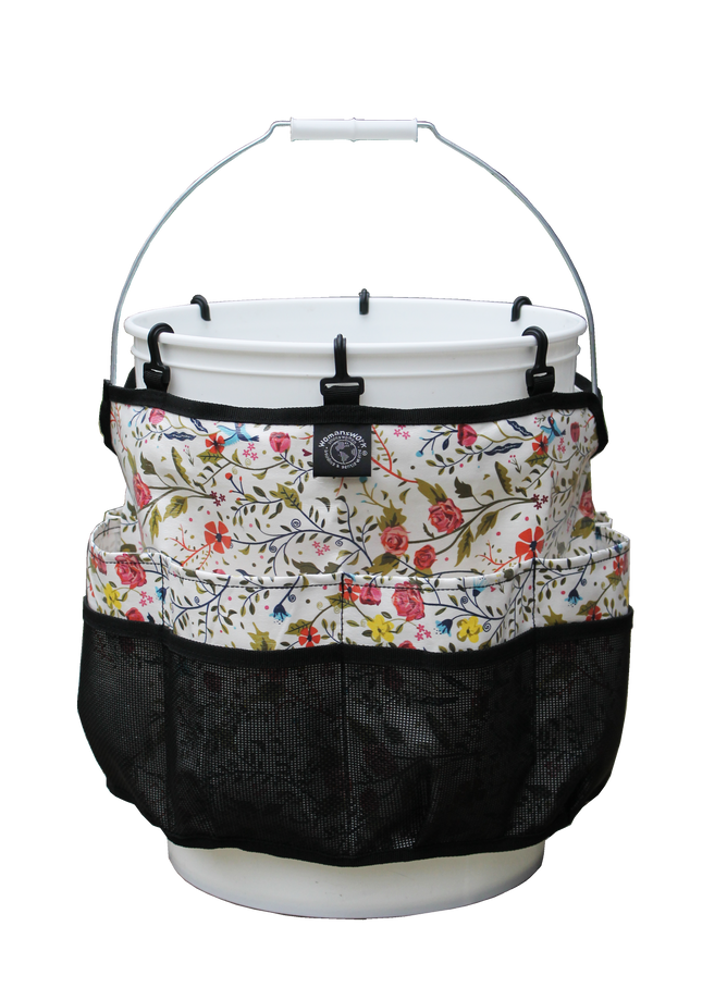 The Womanswork Gardening Organizing Bucket Caddy transforms a white bucket into a garden organizer with floral-patterned fabric pockets. The black mesh bottoms complement vibrant pink, red, and green accents—ideal for storing gardening tools.