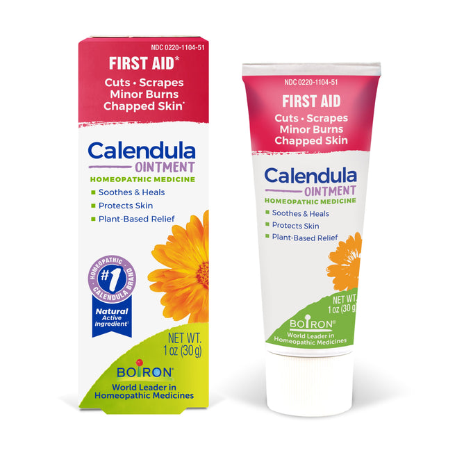 Boiron Calendula Ointment, a homeopathic first aid for cuts, scrapes, minor burns, and chapped skin, comes in packaging featuring a yellow calendula flower with red, white, and green accents.