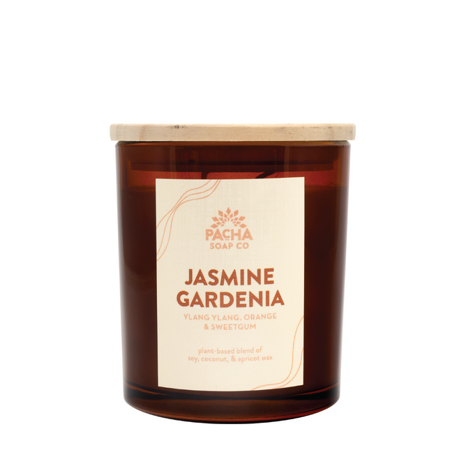 The Pacha Soap Co. Signature Candle - Jasmine Gardenia is a brown glass jar with a wooden lid, citrusy aroma, and plant-based wax blend of soy, coconut, and apricot for a clean burn.