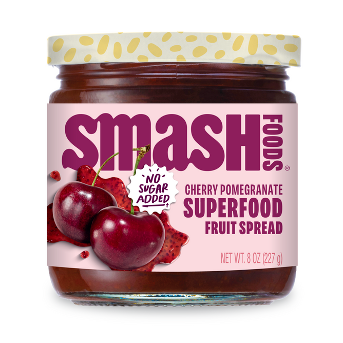 A jar of Smash Foods Superfood Jam - Raspberry with No Sugar Added text on the label, naturally sweetened and featuring raspberry images on a white background. The jar contains 8 oz (227 g).