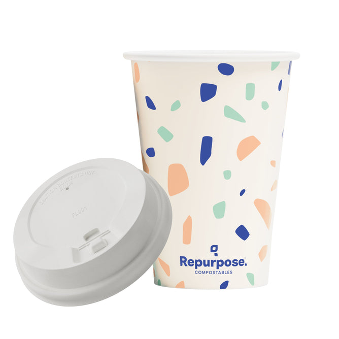 A white Repurpose Compostable Cup & Lid Set featuring a colorful terrazzo pattern, gray lid, BPA free and branded with the Repurpose logo and COMPOSTABLES near the base.