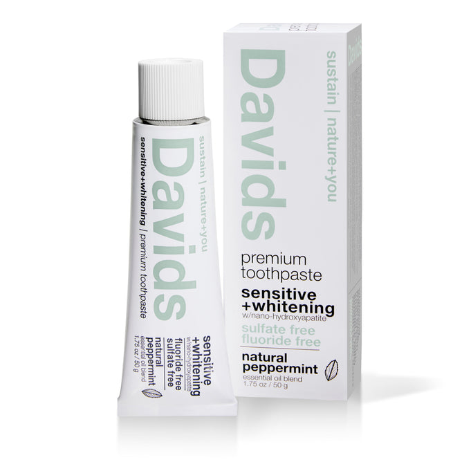 A tube and box of Davids Sensitive Whitening Nano-Hydroxyapatite Toothpaste - Sample, labeled sulfate free and natural peppermint, in green and black on white—upright for display; ideal for sensitive teeth relief.