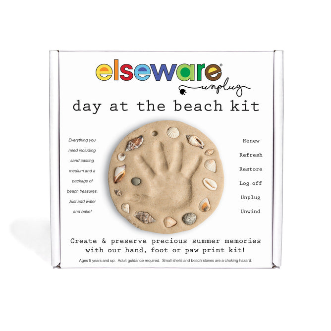 The A Day at the Beach Set by Elseware Unplug includes a sand casting mold with seashells and space for a handprint, along with instructions and materials to create and preserve hand, foot, or paw prints.
