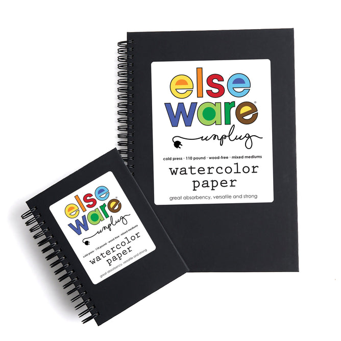 Two black spiral-bound Elseware Unplug Large Watercolor Paper Pads with cold press pages displayed on a white background. Each cover features a colorful logo and product details.