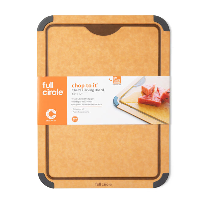 A rectangular Full Circle Chop cutting board, tan with a textured surface, rounded corners, and dark brown edges. Its BPA-free, recyclable, and dishwasher safe. An orange label highlights its convenience and safety.