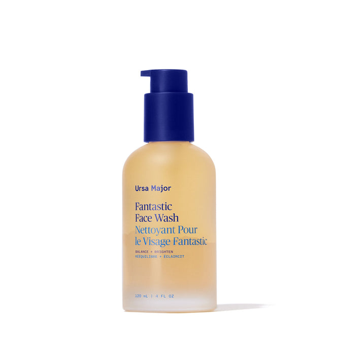 A clear frosted bottle with a blue pump, featuring blue and gold text, contains 4 fl oz (120 ml) of Ursa Major Fantastic Face Wash—a naturally nourishing daily cleanser labeled in English and French.