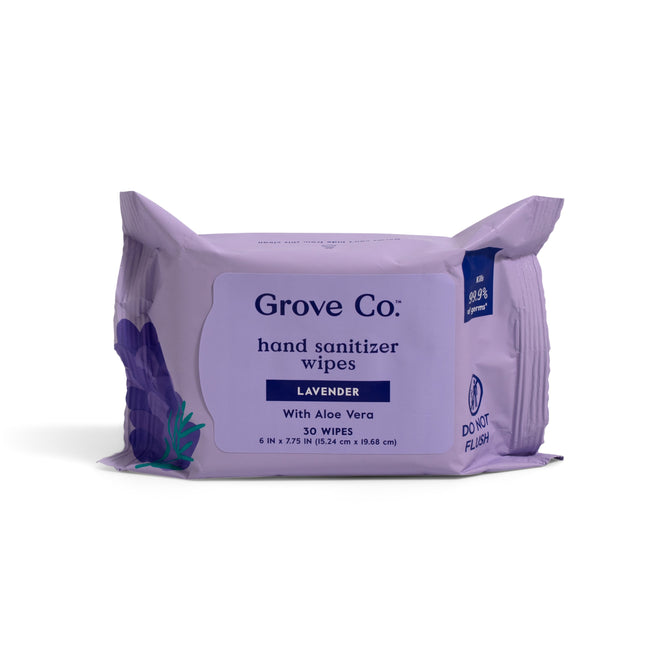 A lavender pack of Grove Co. Hand Sanitizing Wipes - Kills 99.9% of Germs (VIP), 30 count, with moisturizing aloe and 65% alcohol. Features lavender scent, graphics, and a do not flush notice on the packaging.