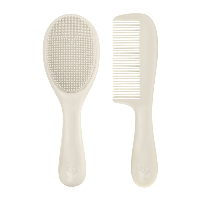 The Sprout Ware Cradle Cap Brush & Comb by Green Sprouts is a beige baby grooming set, featuring a cradle cap brush with soft silicone bristles and an ergonomic handle with a leaf design. The matching comb has wide and narrow teeth, combining simplicity and elegance.