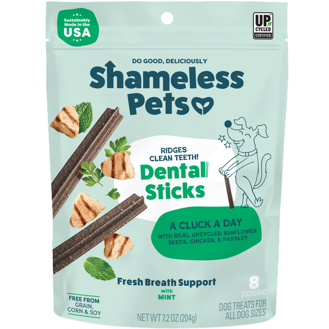 A green bag of Shameless Pets A Cluck A Day Probiotic Dental Stick features minty dental sticks made with real upcycled ingredients like chicken, sunflower seeds, and parsley to help freshen your dog’s breath.