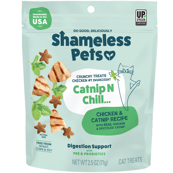 A bag of Shameless Pets Catnip N Chill Crunchy Cat Treats, featuring playful cat and chicken images. The packaging highlights real chicken, upcycled ingredients, and digestion support with prebiotics and probiotics.