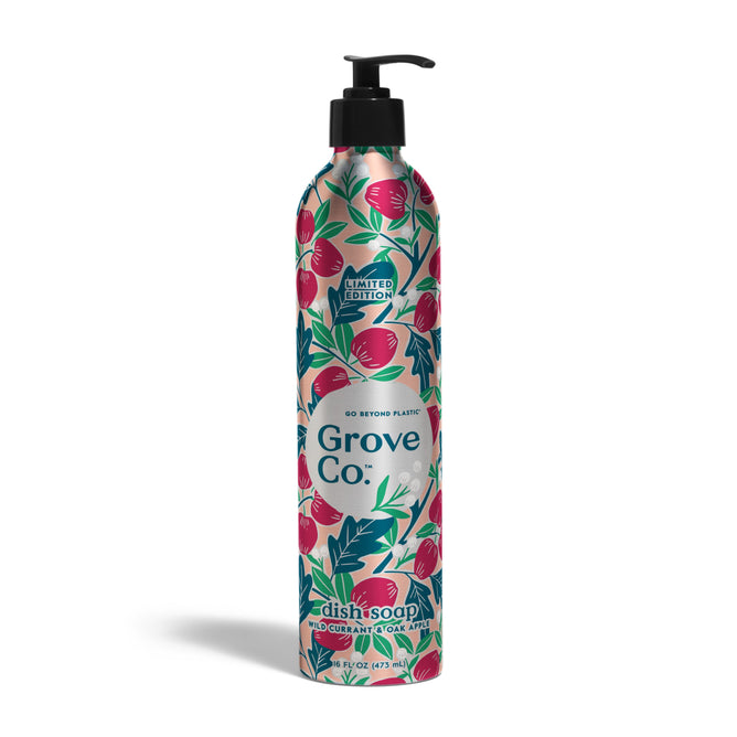 A tall, floral-patterned Grove Co. metal bottle with black pump dispenses Fall Collection Dish Soap Refill, scented red currant and goji (16 fl oz). Label features pink and green fruit illustrations.
