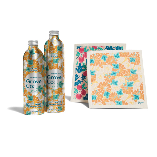 The Grove Co. Kitchen Essentials Set - Fall Collection features two aluminum bottles for hand and dish soap with orange floral designs, plus two reusable cloths with colorful floral prints, all displayed on a white background.
