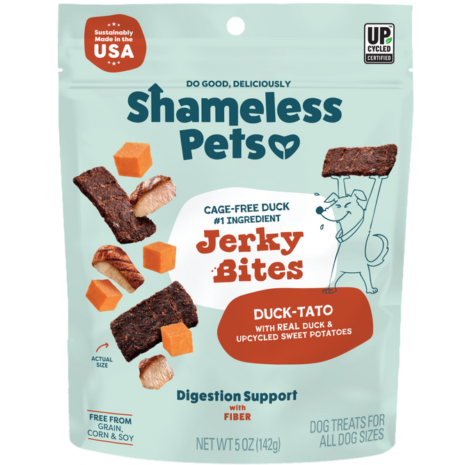 A bag of Shameless Pets Duck-Tato Bite Sized Jerky Dog Treats, featuring images of duck, sweet potato, and jerky. The USA-made packaging highlights digestive health support and upcycled ingredients.