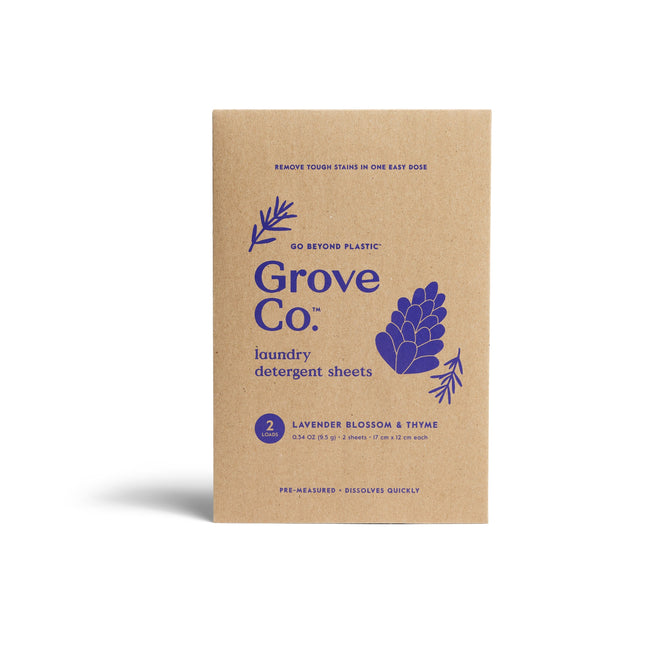 A brown box of Grove Collaborative Laundry Detergent Sheets - Sample in Lavender Blossom & Thyme, with purple botanical designs on the front—made to tackle tough stains easily.