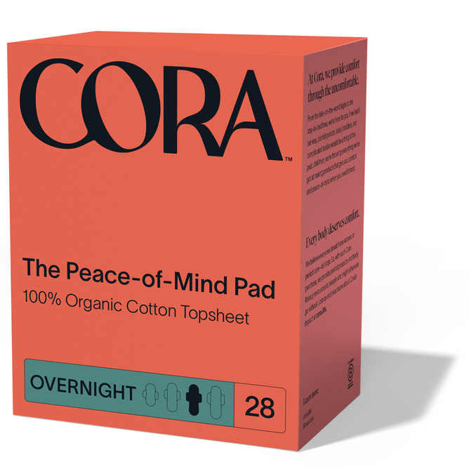 A red box of Cora Peace of Mind Pad, 100% organic cotton overnight pads with a breathable topsheet; contains 28 pads. The front features black and teal text and a teal OVERNIGHT label at the bottom.