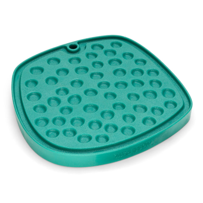The West Paw Seaflex Bubbles Feast Mat is a teal square silicone mat featuring raised circular bumps and a small corner hole, designed as an all-in-one slow feeder and lick mat for enrichment.