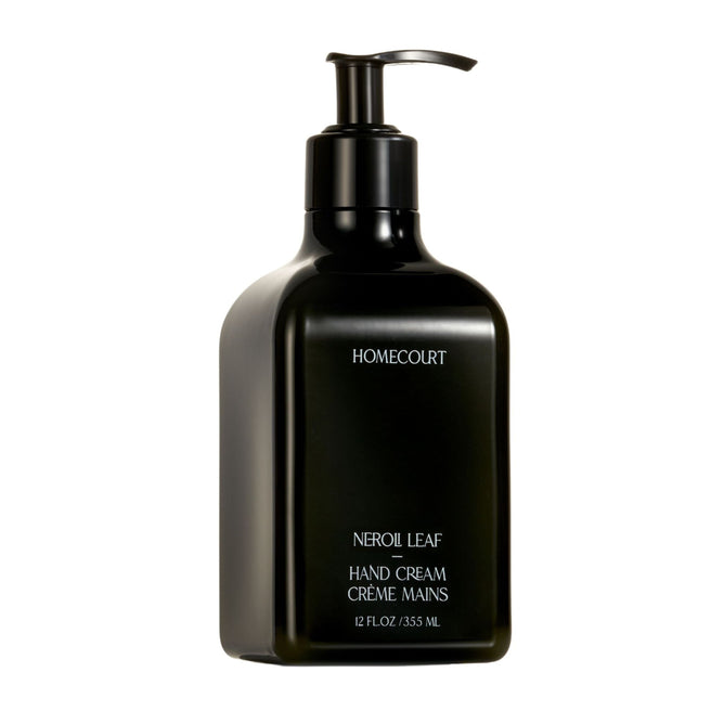 A black pump bottle labeled Homecourt Hand Cream, dermatologist-tested and moisturizing, 12 fl oz/355 mL, stands against a white background.