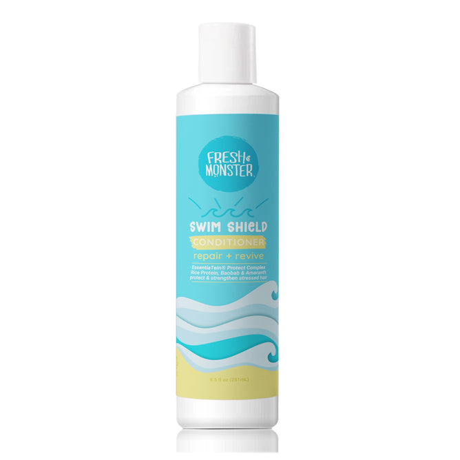 A white bottle of Fresh Monster Swim Shield Chlorine Repair Conditioner with a blue and yellow wave label—formulated for deep hydration and to repair swimmers hair, featuring the Essential Tamer Protect Complex.