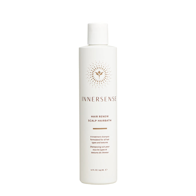 A white bottle of Innersense Organic Beauty Hair Renew Scalp Hairbath, featuring a minimalist design, supports scalp moisture and promotes healthy hair growth for all hair types and textures.