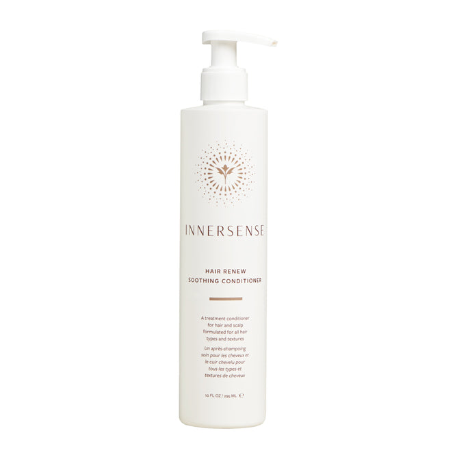 A white pump bottle of Innersense Organic Beauty Hair Renew Scalp Conditioner with gold and brown text and a sunburst logo stands upright against a plain white background, ready to nourish and fortify hair.