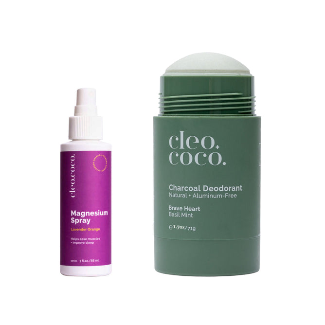 On the left is a bottle of Cleo+Coco Magnesium Spray, enriched with lavender oils for odor removal. Next to it, theres a stick of Cleo+Coco Brave Heart Basil Mint Charcoal Deodorant. Both are upright against a white background from Grove Collaboratives product line.